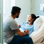woman lying in hospital bed